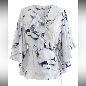 BUTTERFLY FLARE SLEEVE PRINTED WRAP TOP IN BLUE
